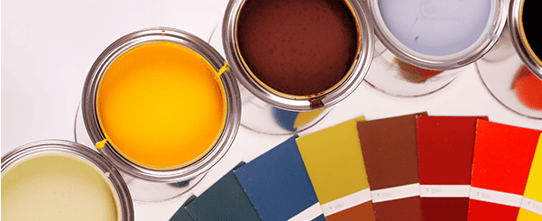 Open paint tins with bright colors and matching color swatches